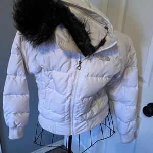 Small woman’s Northface hooded winter jacket with detachable fur.